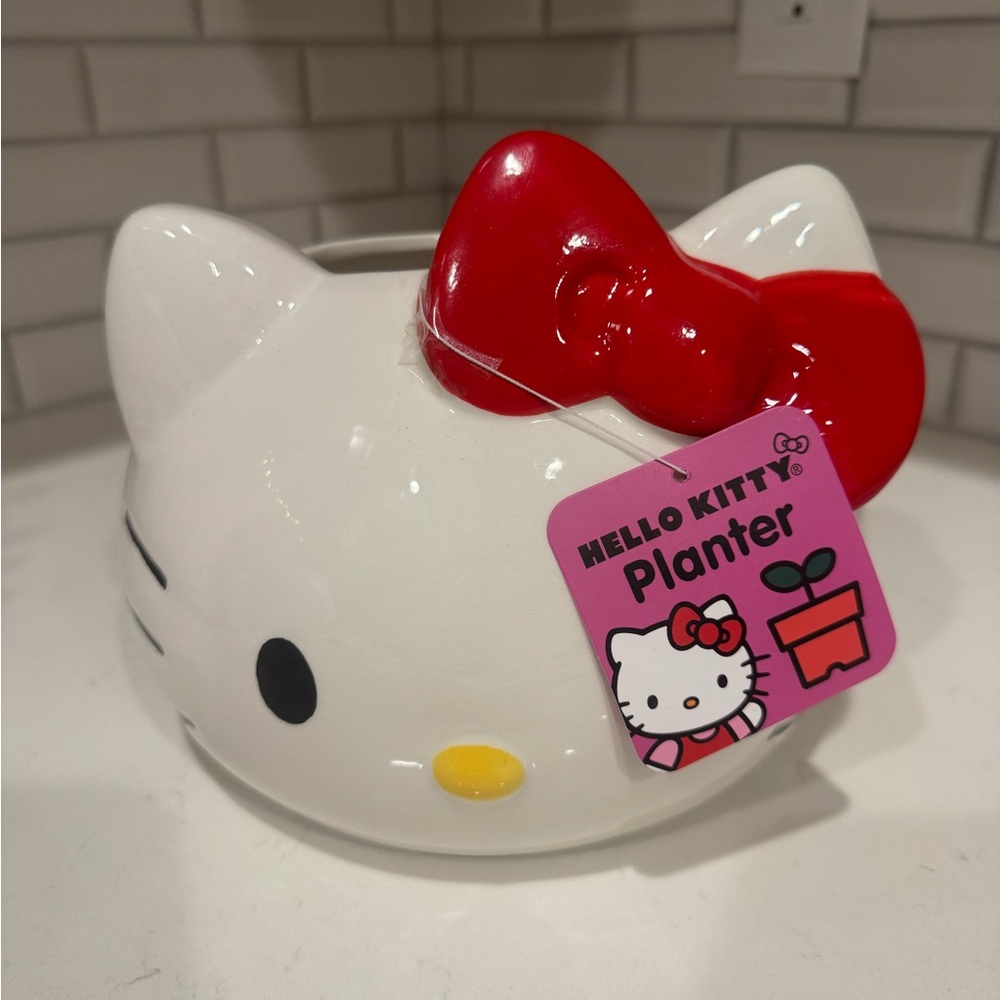 Hello Kitty planter with red bow